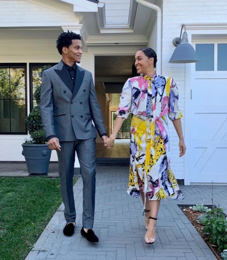 Tia Mowry and her husband Cory Hardrict pose for a picture in front of their house. 